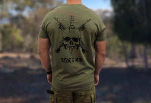 Australian soldier wearing camouflage pants and military green undershirt with a design of bayonet and skull saying stack em
